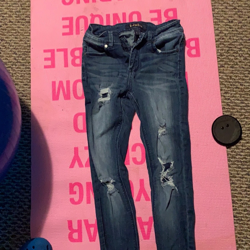 Distressed blue jeans